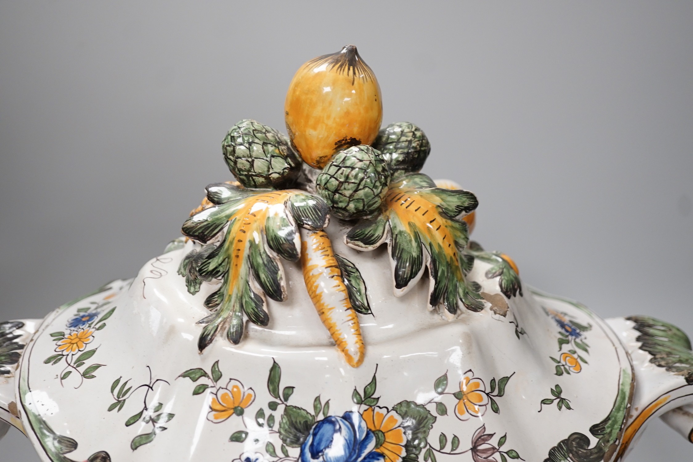 A 19th century French faience large tureen, cover and stand, 49cm wide